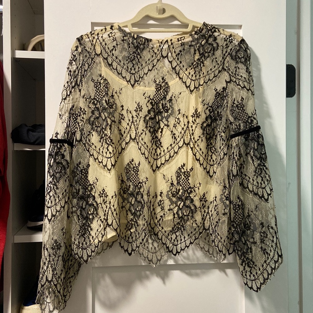 An altered state breezy mesh top.